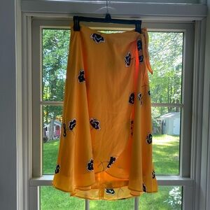 Ann Taylor skirt, brand new with tags. Yellow midi skirt with blue flower print.